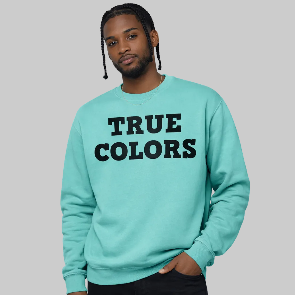 Person wearing a light blue sweatshirt with 'TRUE COLORS' text on a white background