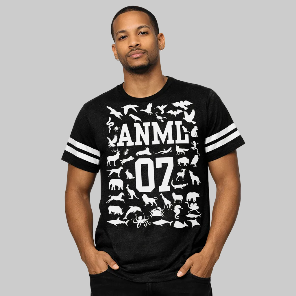 Man wearing a black t-shirt with white animal illustrations and text