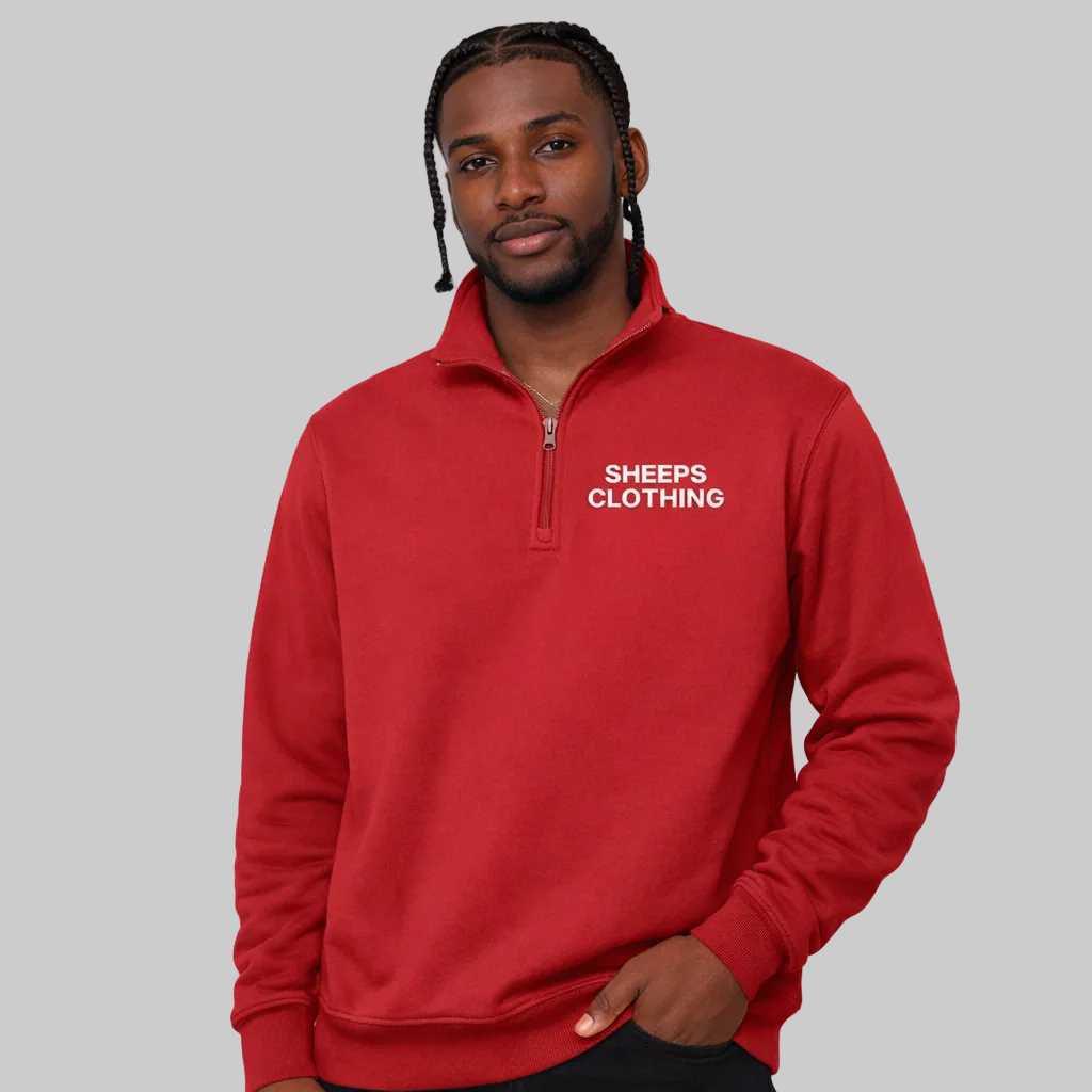 Man wearing a red pullover with 'SHEEPS CLOTHING' logo on a white background
