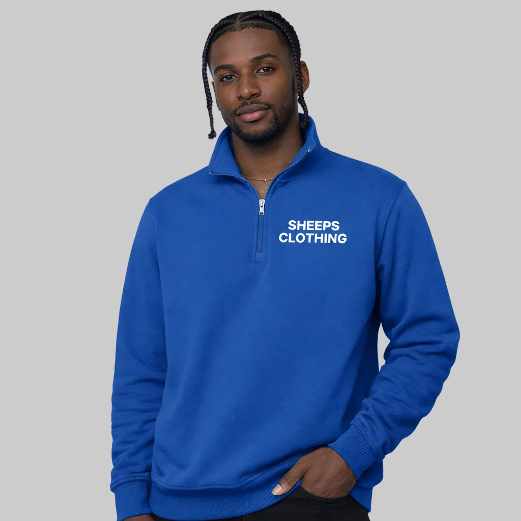Man wearing a blue pullover with 'SHEEPS CLOTHING' text on a white background