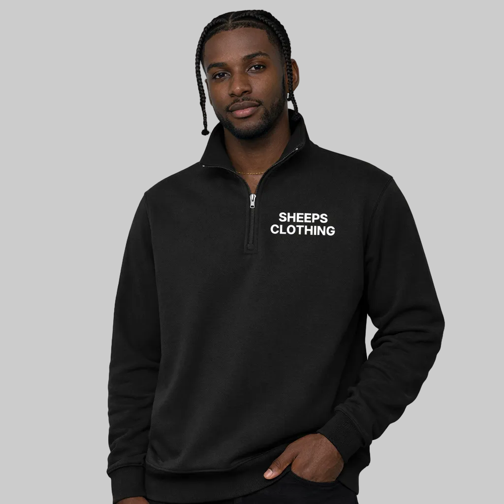 Man wearing a black quarter-zip sweatshirt with 'SHEEPS CLOTHING' text on a white background