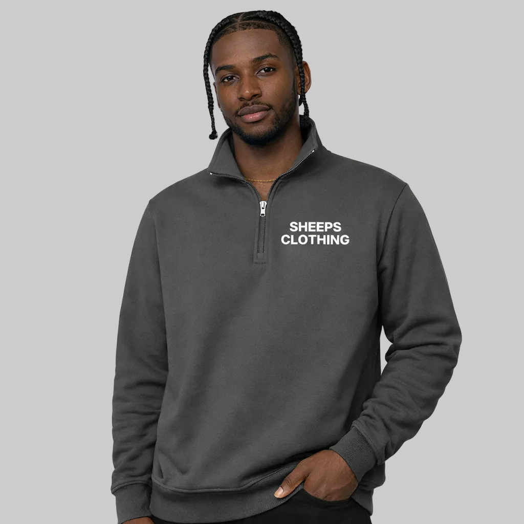 Man wearing a gray pullover with 'SHEEPS CLOTHING' text on a white background