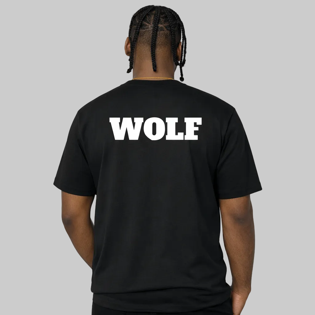 Person wearing a black t-shirt with 'WOLF' printed on the back against a white background