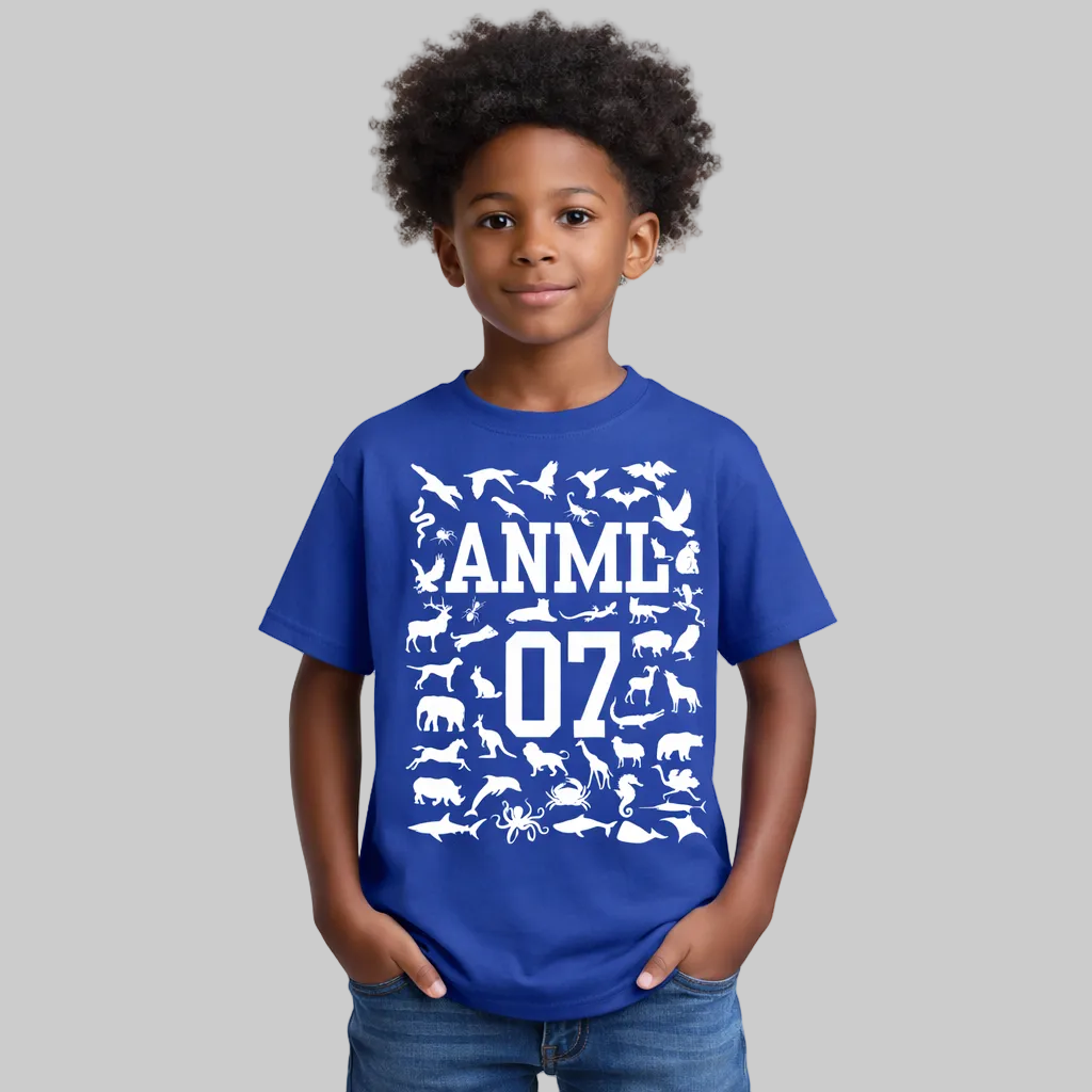 Child wearing a blue t-shirt with white animal illustrations and text on a white background