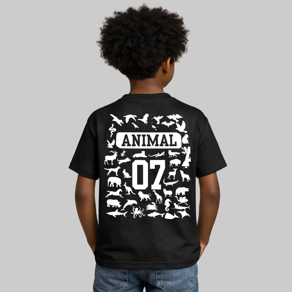 Child wearing a black t-shirt with white animal illustrations and text on the back