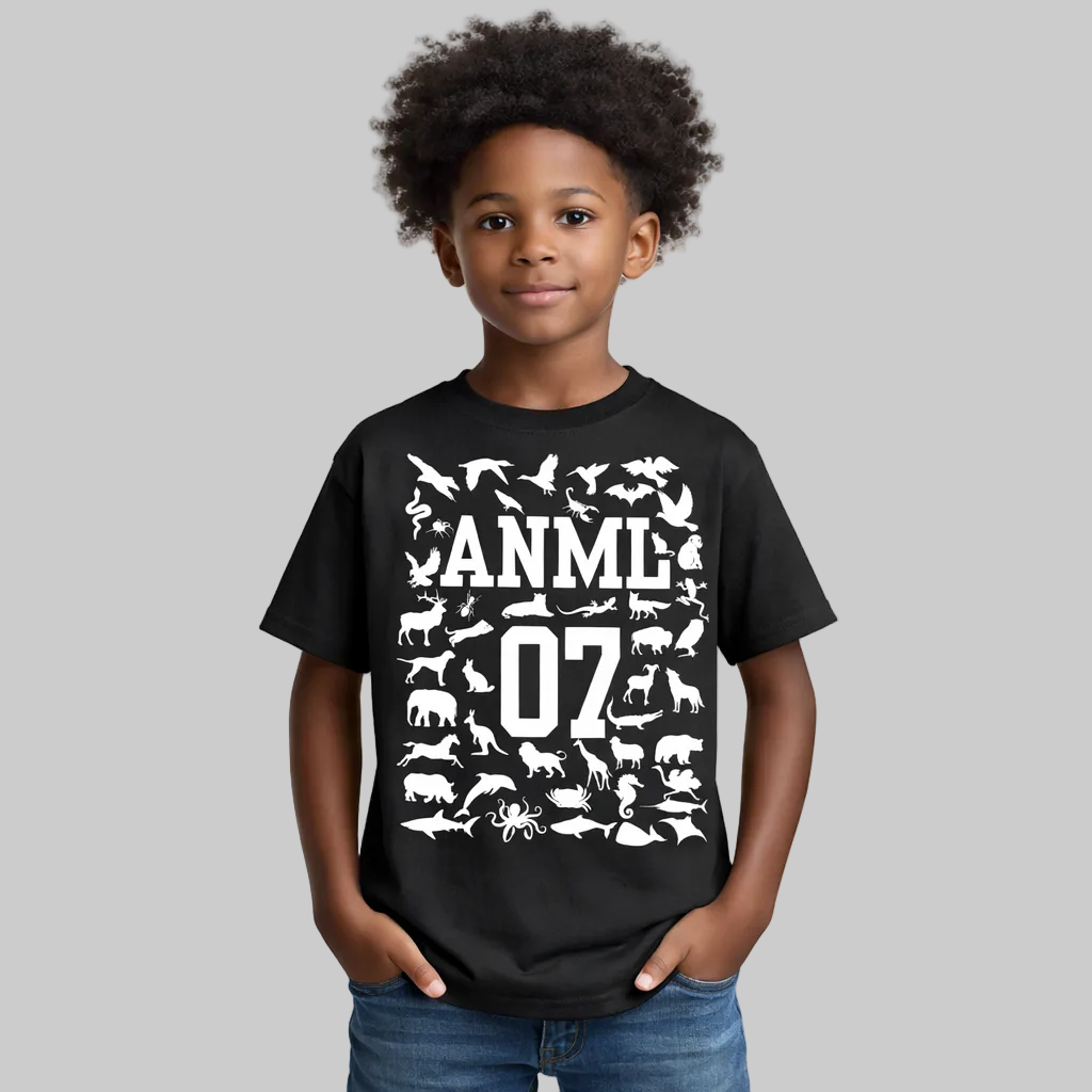 Child wearing a black t-shirt with white animal illustrations and text on a white background