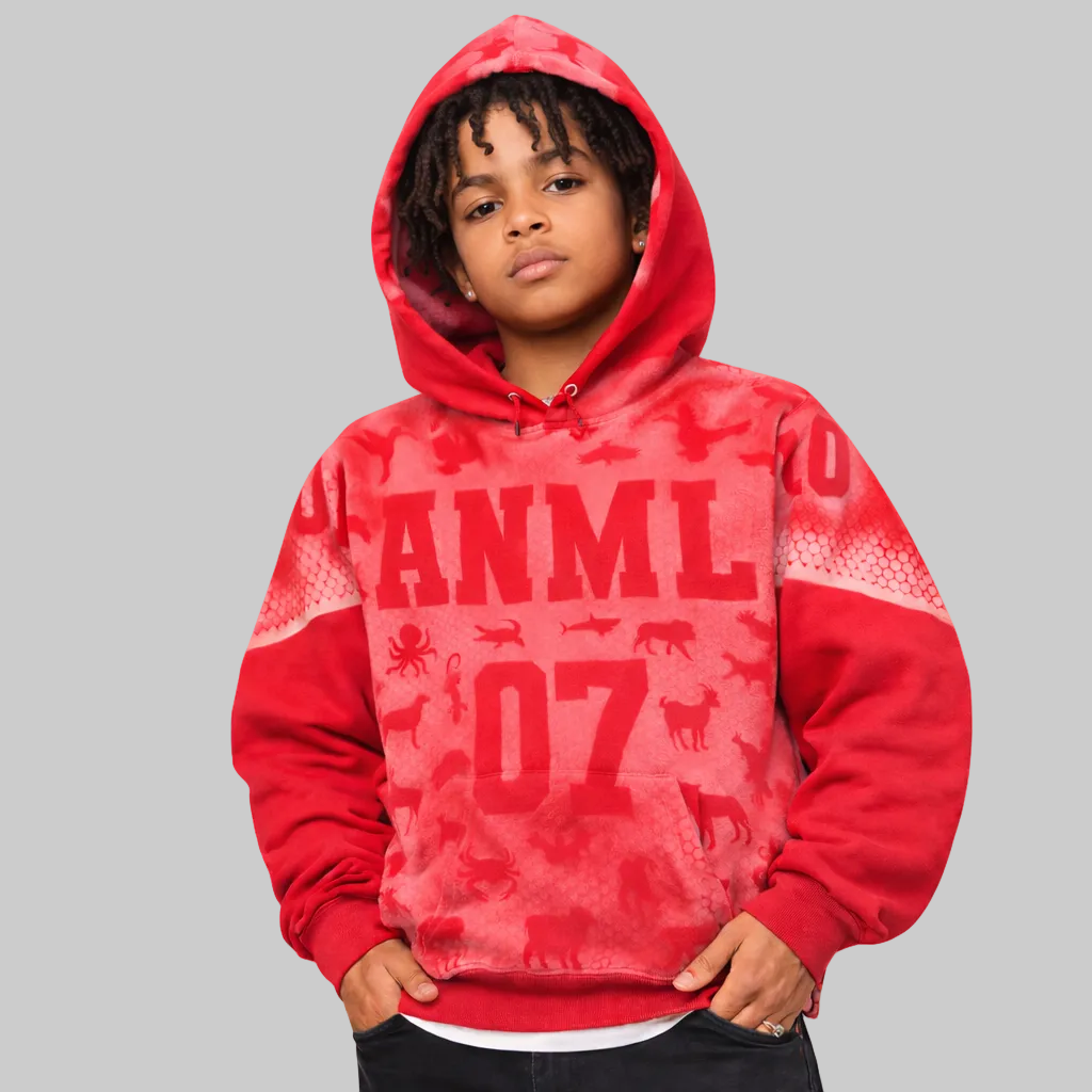 Child wearing a red hoodie with 'ANML 07' print on a white background