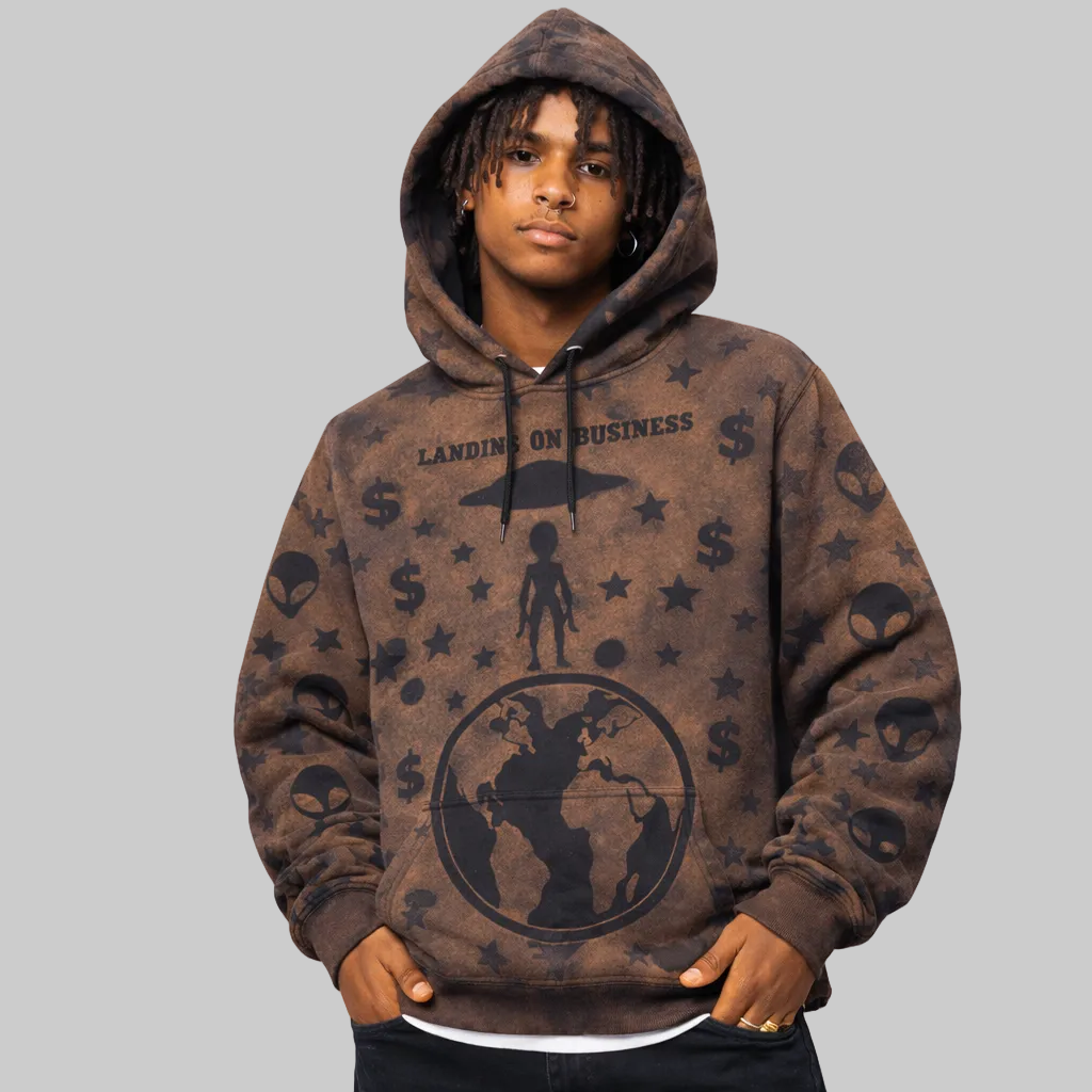 Person wearing a brown hoodie with graphics and text on a white background