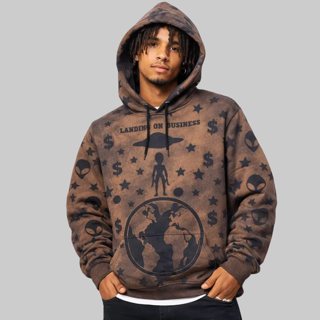 Man wearing a brown hoodie with black graphics and text on a white background