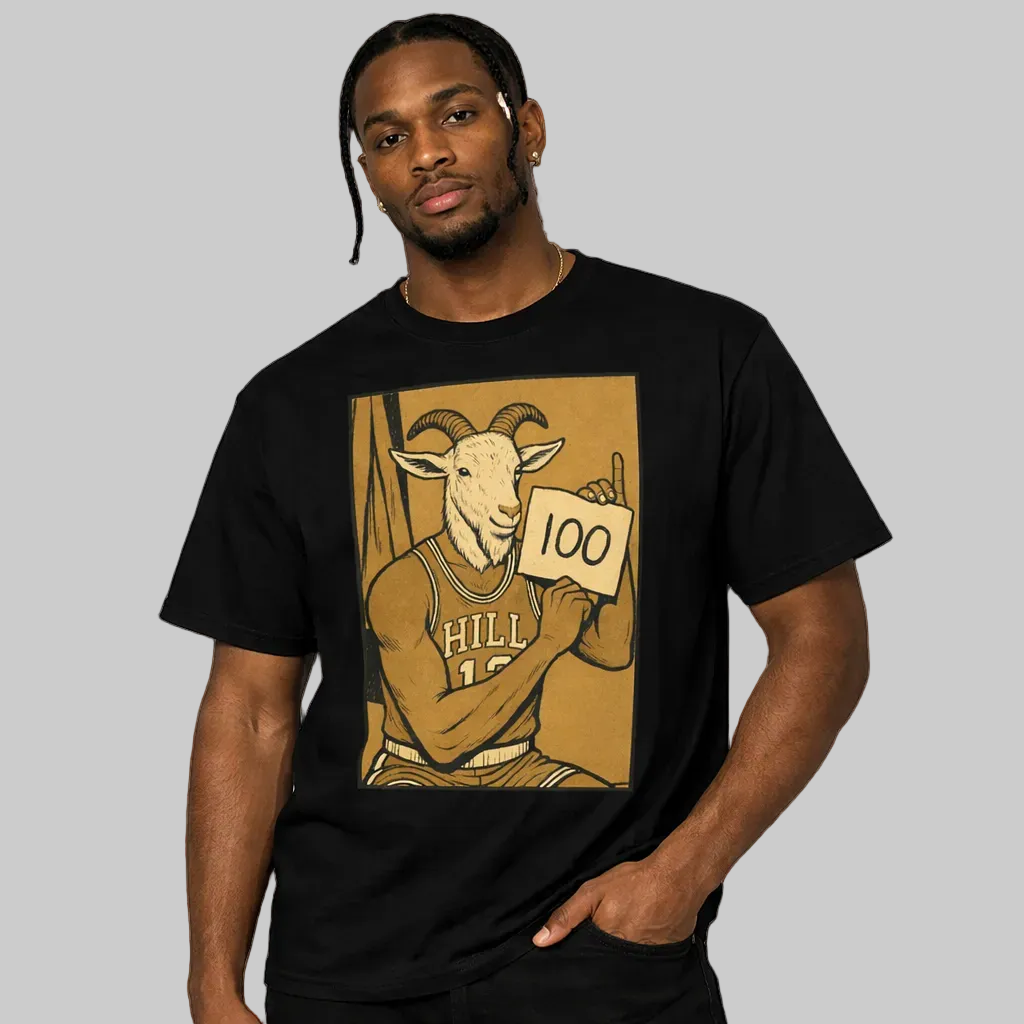 Man wearing a black t-shirt with a graphic design of a goat holding a '100' card.