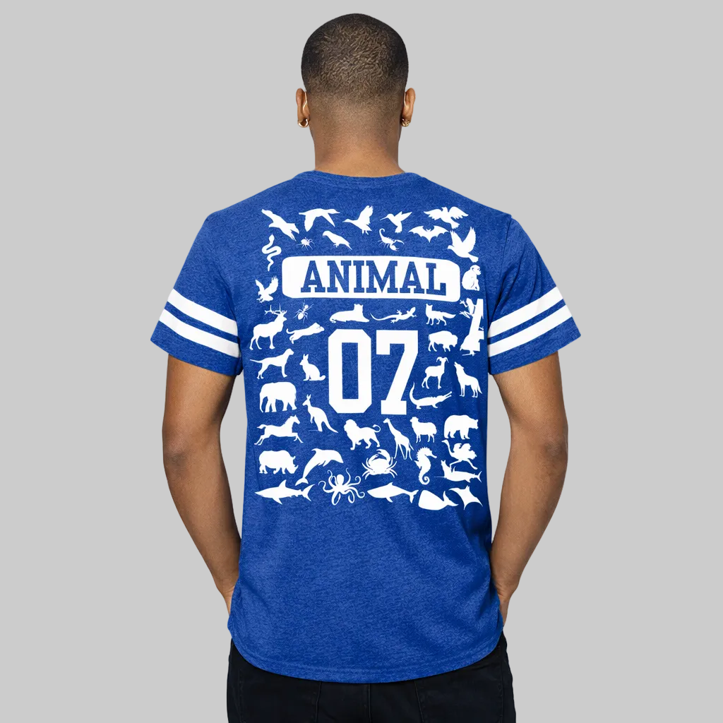 Man wearing a blue t-shirt with white animal illustrations and text on the back.