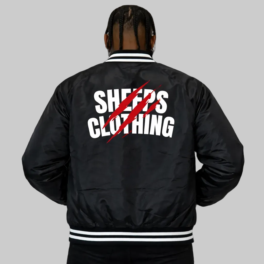 Person wearing a black jacket with 'Sheeps Clothing' text on the back