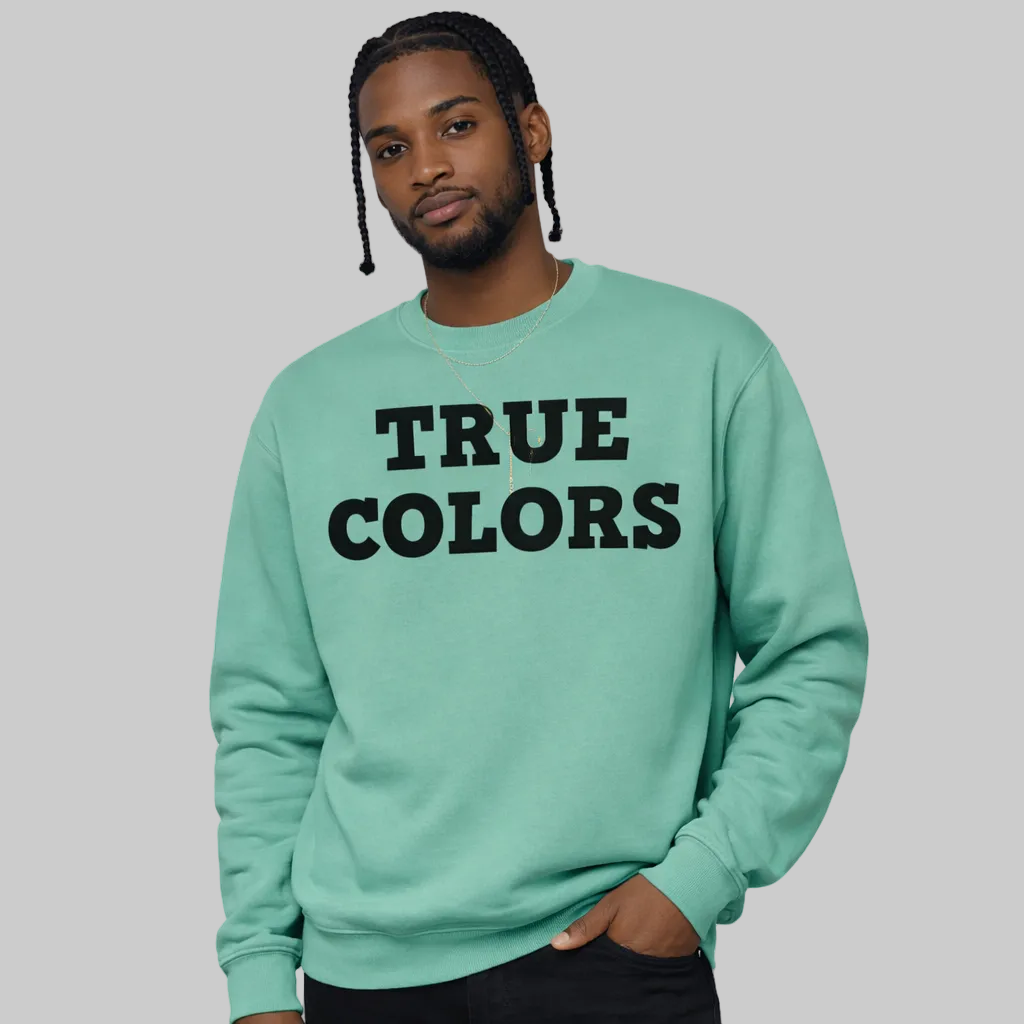 Person wearing a light blue sweatshirt with 'TRUE COLORS' text on a white background