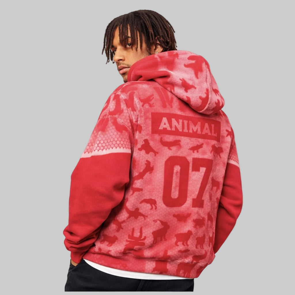 Red hoodie with 'ANIMAL 07' design on the back, worn by a person.